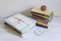 Stacks of different books, magazines and paper tied with rope