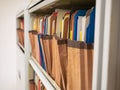 Stacks of document paper and files folder in a filing cabinet