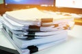 Stacks of documents files for finance of office working.Business report papers or Piles of unfinished document achieves with