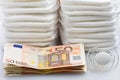 Stacks of Euro Banknotes Diapers and Pacifier