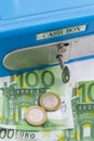 Stacks of euro coins and banknotes in a cash box Royalty Free Stock Photo