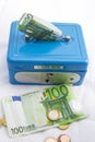 Stacks of euro coins and banknotes in a cash box Royalty Free Stock Photo