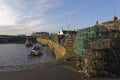 Stacks of Fishing Pots for Crabs and Lobsters on the Quayside of the inner harbour of Johnshaven Royalty Free Stock Photo