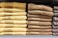 Stacks of fluffy bath towels in a shop window.