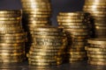 Stacks of gold coins on black background Royalty Free Stock Photo