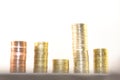 Stacks of gold coins of different levels, on a white background. Concept of financial growth success Royalty Free Stock Photo