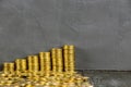 Stacks of gold coins.Gold coins on a wooden table. Money on a black background.Copy space.Treasure Hunt.Chalk rubbed out Royalty Free Stock Photo