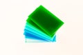 Stacks of green blue pieces of Plexiglas