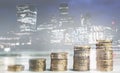 Stacks of growth money coins, double exposure with London finance skyline background