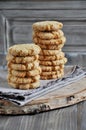 Stacks of homemade honey biscuits with cracks added with coconut