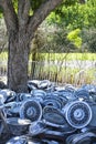 Stacks of hubcaps on ground. Royalty Free Stock Photo