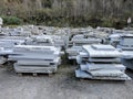 Stacks of industrial slabs of granite placed in a yard