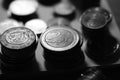 Stacks of iron euro coins on the table, bw photo Royalty Free Stock Photo