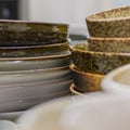 Stacks of Japanese bowls and plates in kitchen drawer. Royalty Free Stock Photo