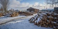 Stacks Of Logs Wait In Snowy Lumberyard With Winter Season Royalty Free Stock Photo