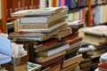 Stacks of many old used books displayed at local antiquarian bookshop Royalty Free Stock Photo