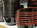 Stacks of melamine black bowl in a department store