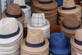 Stacks of mens hats on street counter