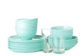 Stacks of mint ceramic dishware isolated on white background Royalty Free Stock Photo