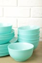 Stacks of mint ceramic dishware on light background Royalty Free Stock Photo