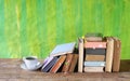 Stacks of multicolored books and a cup of coffee free copy space. Reading, education, literature, learning, relaxing Royalty Free Stock Photo