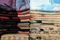 Stacks of multicolored fabrics, a close-up shot, background