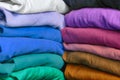 Stacks of multicolored fabrics in cool and warm colors Royalty Free Stock Photo