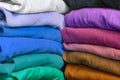 Stacks of multicolored fabrics in cool and warm colors