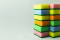 stacks of multicolored sponges on grey