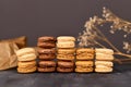 Stacks of natural brown, beige and cream colored French macarons with coffee, mocha, chocolate and vanilla flavour Royalty Free Stock Photo