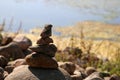 Relaxing, Zen Like View Including Stacks of Natural Rocks and a Lake during a Sunny Day Royalty Free Stock Photo