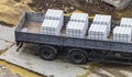 Stacks of new white sand-lime bricks in the back of a truck were taken to the construction site. Delivery of building materials