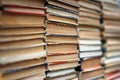 Stacks of old hardback and paperback books. Background image Royalty Free Stock Photo