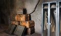 Stacks of old military ammunition boxes in shelter