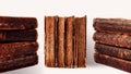 Stacks of old worn shabby books in leather binding isolated on white background. Banner. Selective focus Royalty Free Stock Photo