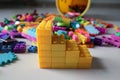 Stacks of one color lego with scattered legos background