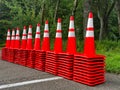Stacks of orange traffic cones in a row Royalty Free Stock Photo