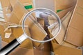 Stacks of paper and cardboard ready to be recycled - Concept image seen through a magnifying glass