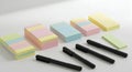 Stacks of pastel sticky notes and black pens Royalty Free Stock Photo