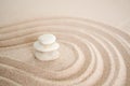 Stacks of pebbles with pattern Zen japanese garden design on sand beach