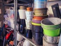 Stacks of plastic pots and vases for flowers and plants standing