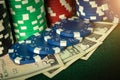 Stacks of playing chips and money on the poker table. A successful bet brought a rich win Royalty Free Stock Photo