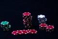 Stacks of poker chips arranged in the black background Royalty Free Stock Photo