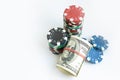 Stacks of poker chips including red, black, white, green and blue on a white background Royalty Free Stock Photo