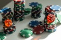Stacks of poker chips including red, black, white, green and blue on a white background Royalty Free Stock Photo