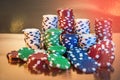 Stacks of poker chips isolated on golden background. Casino Royalty Free Stock Photo