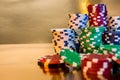 Stacks of poker chips isolated on golden background. Casino Royalty Free Stock Photo