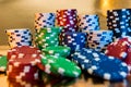 Stacks of poker chips isolated on golden background. Casino Royalty Free Stock Photo