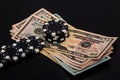 Stacks of poker chips with money on black background Royalty Free Stock Photo