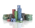 Stacks of poker chips with stack of dollars.